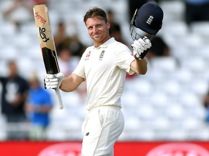 Jos Buttler celebrates after completing his century on Tuesday