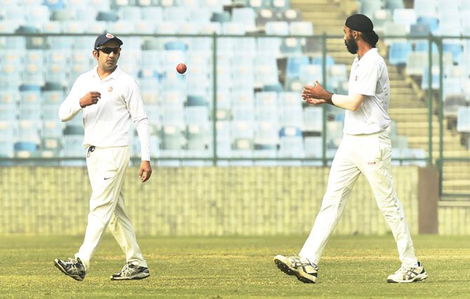 Delhi's Gautam Gambhir (left) in action during the Ranji Trophy match against Andhra Pradesh, his final cricket match, on Thursday