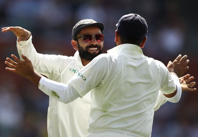 Virat Kohli celebrates after Ravichandran Ashwin took Usman Khawaja's wicketon day four of the first Test at the Adelaide Oval, December 9, 2018