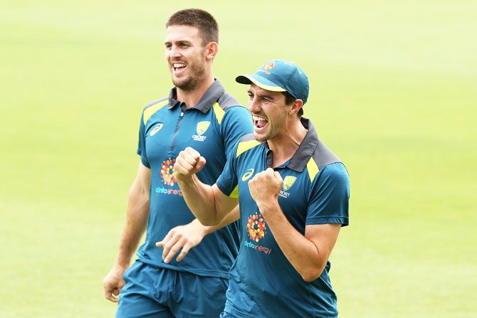 Australia's Mitchell Marsh and Pat Cummins at a warm-up drill during a training session at the WACA on Tuesday, ahead of the Second Test match against India