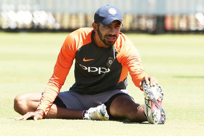 Jasprit Bumrah stretches during a training session in Perth on Thursday