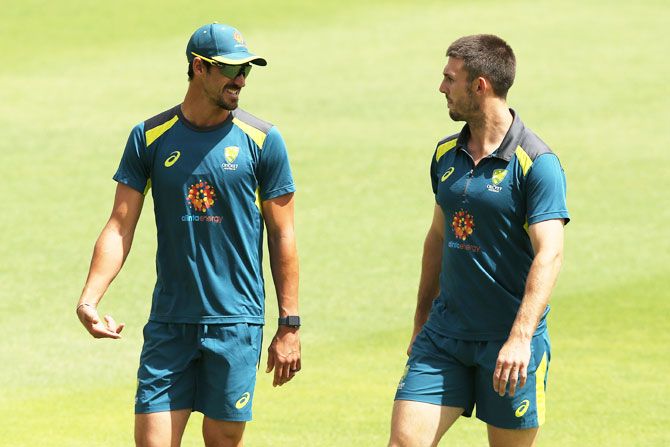 Mitchell Starc and Mitchell Marsh chat during a warm-up sessipn before the nets in Perth on Wednesday