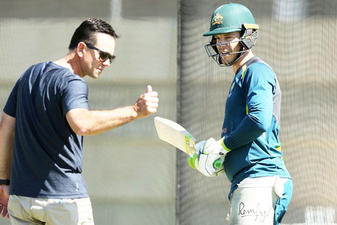 Australia's Tim Paine speaks with Ricky Ponting during an Australian training session at Optus Stadium in Perth on Thursday