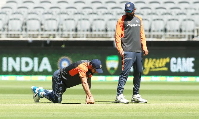 India's Virat Kohli and Mohammed Shami inspect the pitch at Optus Stadium in Perth on Thursday