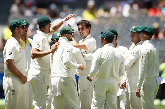 Australia players celebrates after Pat Cummins takes the wicket of Ishant Sharma to win the Test