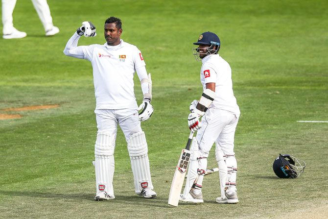 Sri Lanka's Angelo Mathews celebrates his century with Kusal Mendis on Day 4 of the First Test against New Zealand at Basin Reserve in Wellington on Tuesday