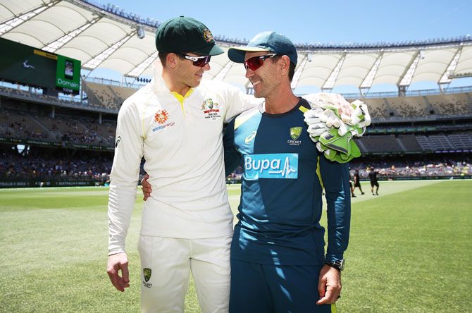 Australia coach Justin Langer celebrates with captain Tim Paine after their win in Perth on Tuesday