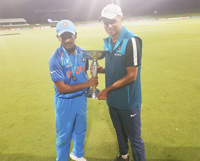 India Under-19 captain Prithvi Shaw and coach Rahul Dravid with the trophy