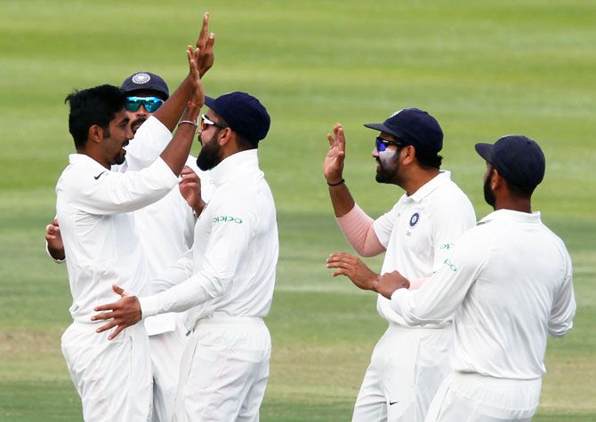 India's players celebrate with Jasprit Bumrah after a dismissal