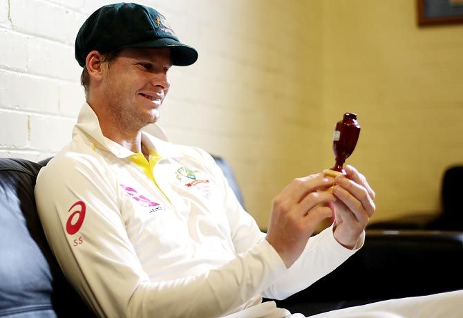 Australia captain Steve Smith spends a quiet moment with the Ashes Urn