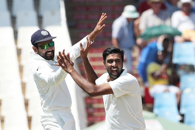  India's Ravichandran Ashwin celebrates with Rohit Sharma after picking the wicket of South Africa's Aiden Markram