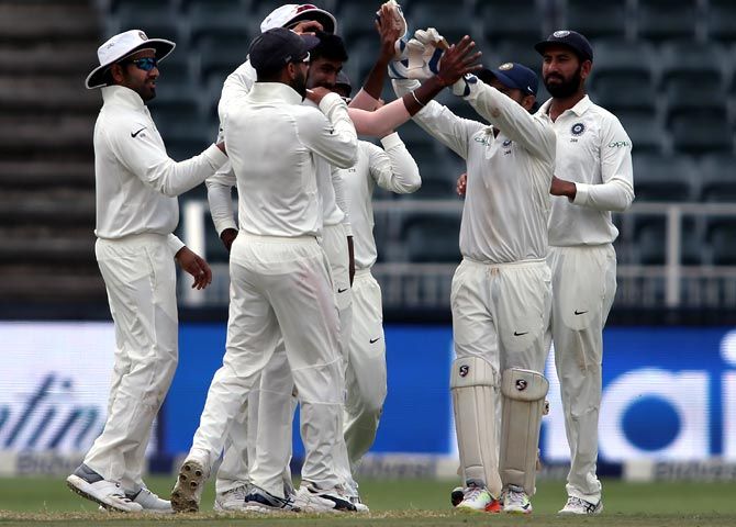 India players celebrate the wicket of South Africa's Faf du Plessis