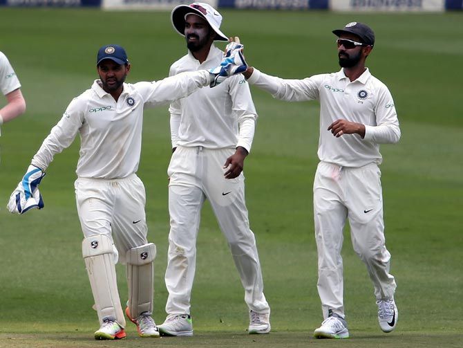India's players celebrate the wicket of Kagiso Rabada