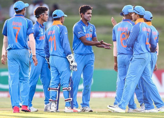 India under-19 players celebrate a wicket