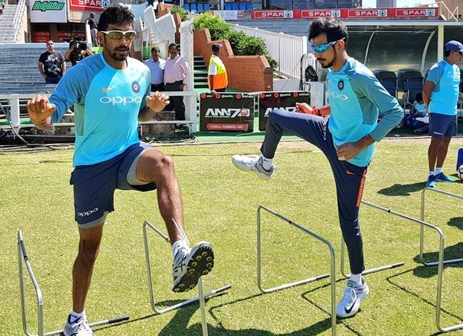 Jasprit Bumrah, left, with Yuzvendra Chahal during Team India's training session in Durban