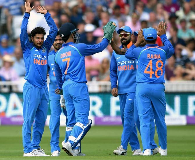 Kuldeep Yadav, left, celebrates with team mates after taking the wicket of Ben Stokes on Thursday