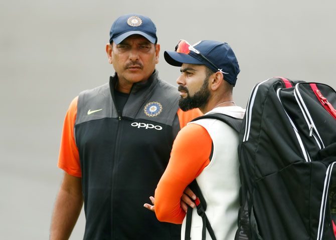 India head coach Ravi Shastri and captain Virat Kohli chat at the nets on Monday