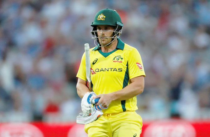 Australia's Aaron Finch walks off after his dismissal