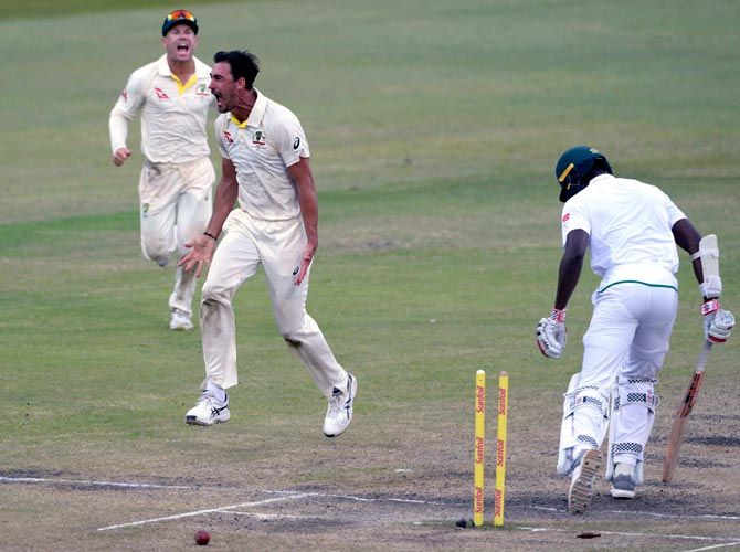 Mitchell Starc celebrates after dismissing Kagiso Rabada in the first Test in Durban