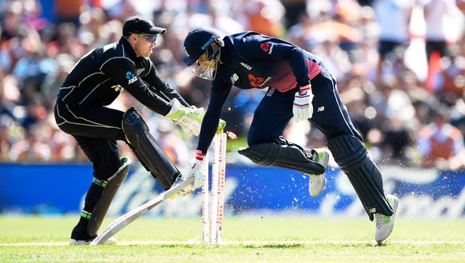 England batsman Joe Root makes his ground to reach his century to foil a the run out attempt as New Zealand's Tom Latham whips the bails off