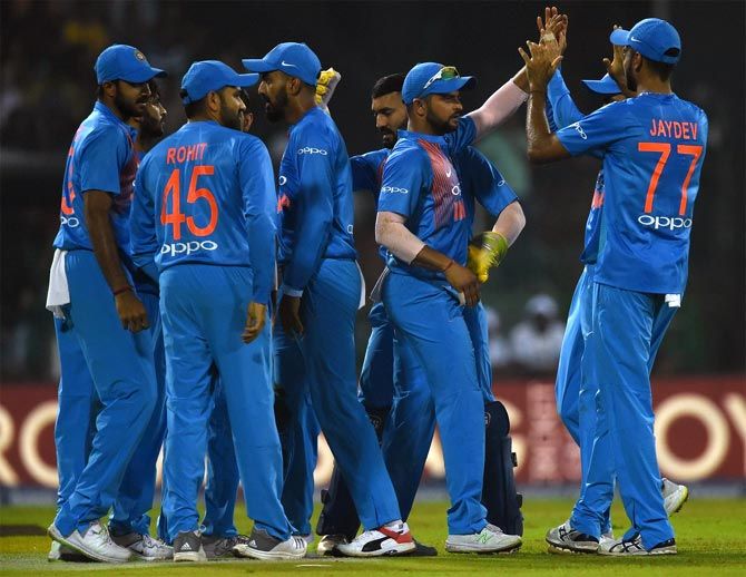 India's players celebrate a wicket during the fourth T20 International against Sri Lanka