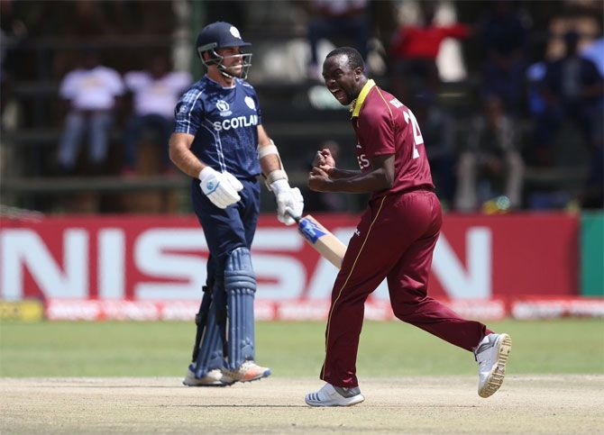 A West Indies bowler celebrates a Scotland wicket