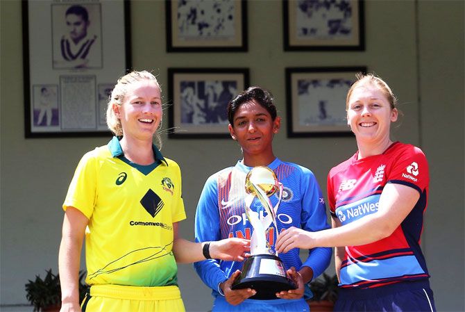 India captain Harmanpreet Kaur is flanked by Australia captain Meg Lanning and England captain Heather Knight as they pose for a photo with the winners trophy ahead of the Womens T20I Tri-series at Brabourne stadium in Mumbai on Wednesday
