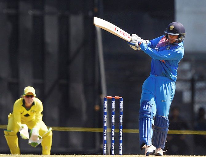 Indian batswoman Smriti Mandhana plays a shot in the opening match against Australia during the Women's T20I Tri-series at Brabourne stadium in Mumbai on Thursday