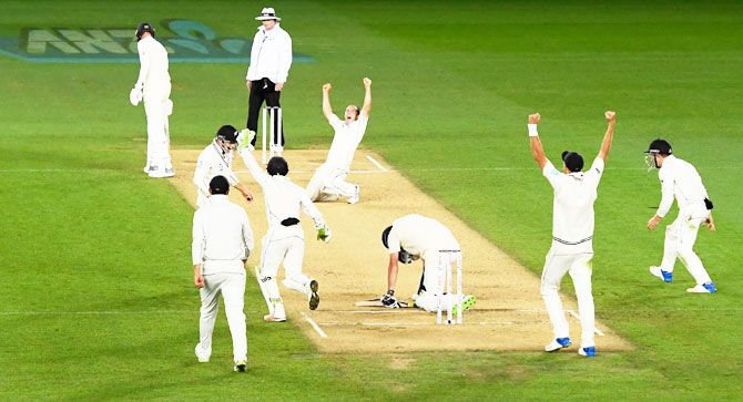 New Zealand bowler Todd Astle celebrates after dismissing England's James Anderson to win the first Test match on Day five at Eden Park in Auckland on Monday
