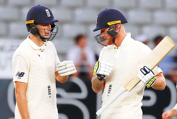 England's Chris Woakes and Ben Stokes during their defiant stand of 83 in almost 31 overs