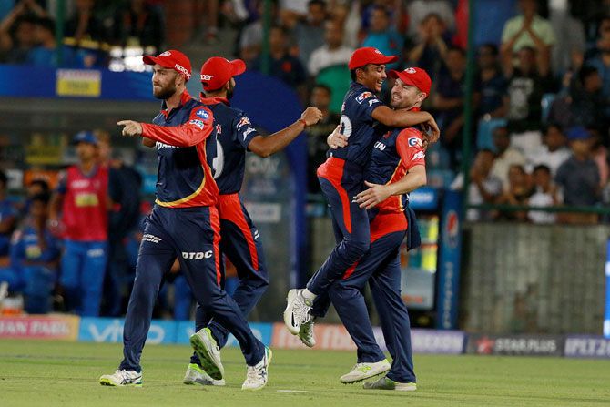Delhi Daredevils players celebrate the wicket of Rajasthan Royals' Sanju Samson