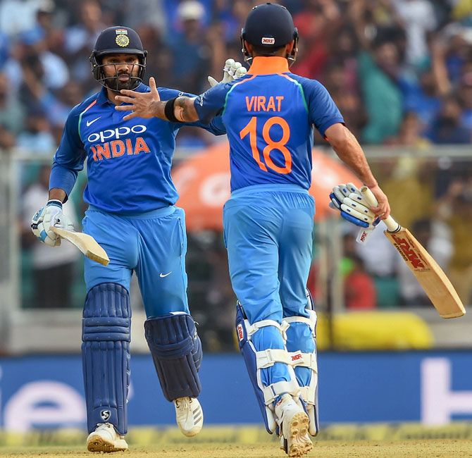Rohit Sharma, left, and Virat Kohli celebrate winning the fifth ODI against the West Indies and the series 3-1. Photograph: PTI