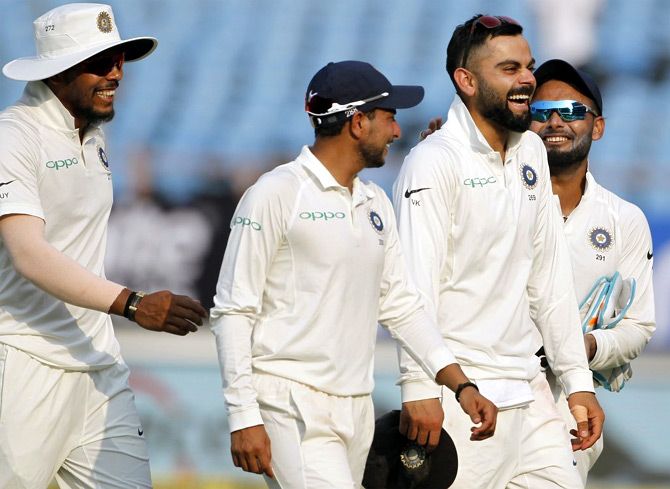 Virat Kohli, Umesh Yadav, Kuldeep Yadav and Rishabh Pant celebrate bowling out the West Indies for 181 in the first innings in the Rajkot Test, October 6, 2018. Photograph: BCCI/Twitter