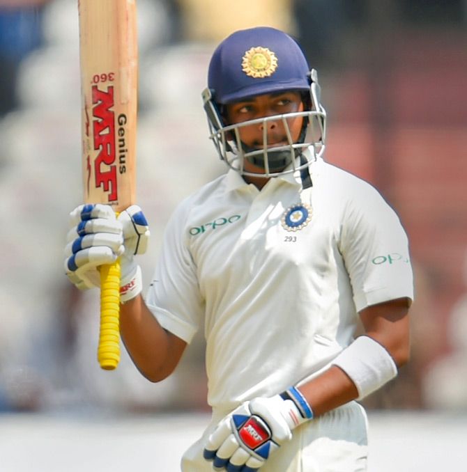 Prithvi Shaw celebrates after completing his half-century