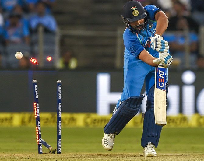 Rohit Sharma is bowled by West Indies captain Jason Holder