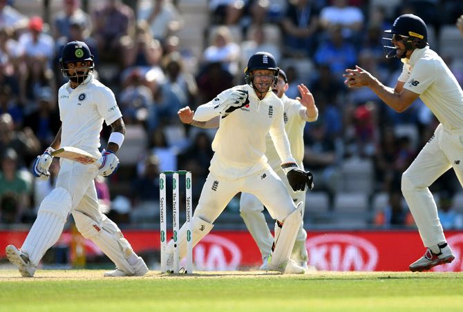 Virat Kohli is caught by Alastair Cook at short leg off Moeen Ali's bowling