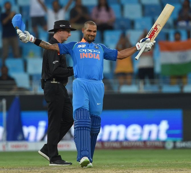 Shikhar Dhawan celebrates on completing his century against Hong Kong on Tuesday