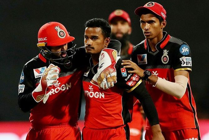 Pawan Negi is congratulated by his RCB teammates