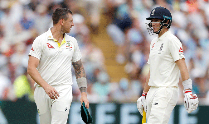 Australia's James Pattinson has words with England captain Joe Root after a Pattinson delivery to Root hit the bail but failed to dislodge it