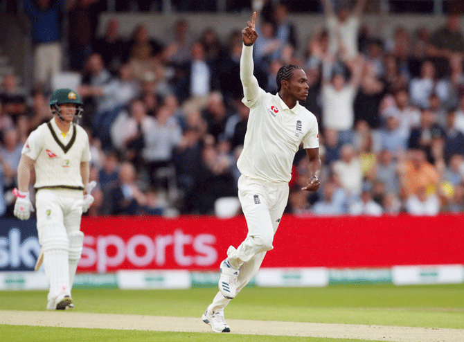 England's Jofra Archer celebrates taking the wicket of Australia's Marcus Harris 