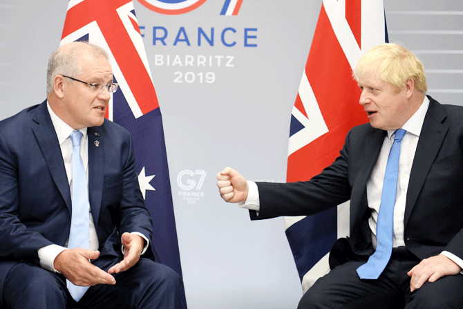 Britain's Prime Minister Boris Johnson (right) meets Australian Prime Minister Scott Morrison (left) for bilateral talks during the G7 summit in Biarritz, France, on Monday