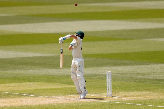 Australia's Steve Smith tries to fend off a short ball from New Zealand's Neil Wagner but is caught out