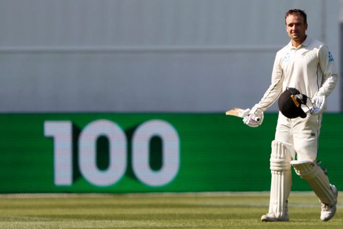 New Zealand's Tom Blundell raises his bat after scoring his century