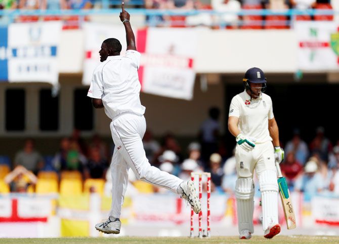 West Indies' Jason Holder celebrates the wicket of England's Jos Buttler on Day 1 of the 2nd Test at Sir Vivian Richards Stadium, North Sound, Antigua and Barbuda on Thursday