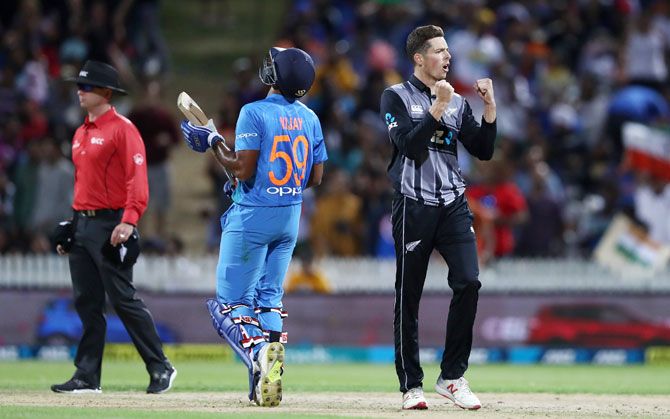 Mitchell Santner celebrates the wicket of Vijay Shankar
