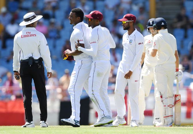 West Indies bowler Shannon Gabriel (left) is ushered away by teammate Kraigg Brathwaite after confronting England's Joe Root and Joe Denly on Day 3 of the 3rd Test at Darren Sammy Cricket Ground in Gros Islet, Saint Lucia, on Tuesday. Root, who finished the day on 111 not out, refused to divulge what Gabriel said when asked about the incident at the end of day's play, saying it should stay on the field