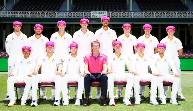 The Australian Men's Test Cricket team pose with former pacer Glenn McGrath for a photograph on Wednesday wearing the 'Baggy Pink' in support of the McGrath Foundation during the launch of Thursday's Pink Test at the Sydney Cricket Ground