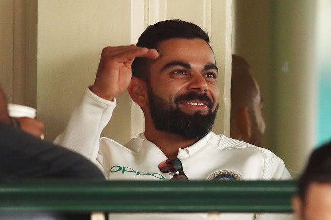 India captain Virat Kohli has a light moment in the dressing room on Day 4 of the 4th Test at the SCG in Sydney on Sunday