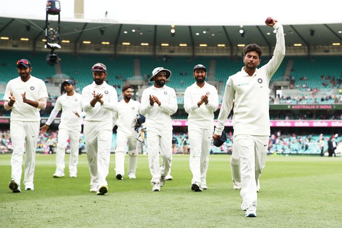 Kuldeep Yadav leads the Indian team out of the field after his five-wicket haul against Australia on Day 4