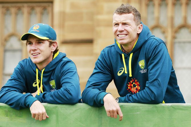 Australia's Adam Zampa and Peter Siddle look on during the Cricket Australia Fan Day at the University of Sydney in Sydney on Thursday
